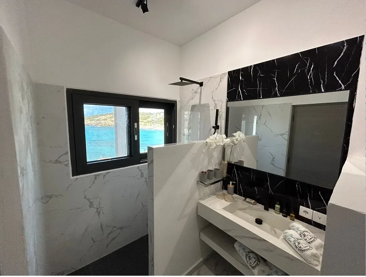 GEORGE Group bathroom visual with a long vanity, mirrors, basins, taps, shower enclosure and other sanitary fixtures