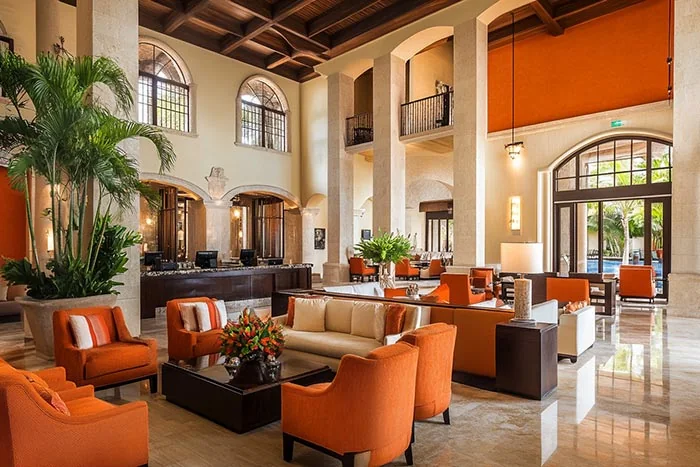 Hotel public area with multiple lounge seating groups in a GEORGE Group furniture visual