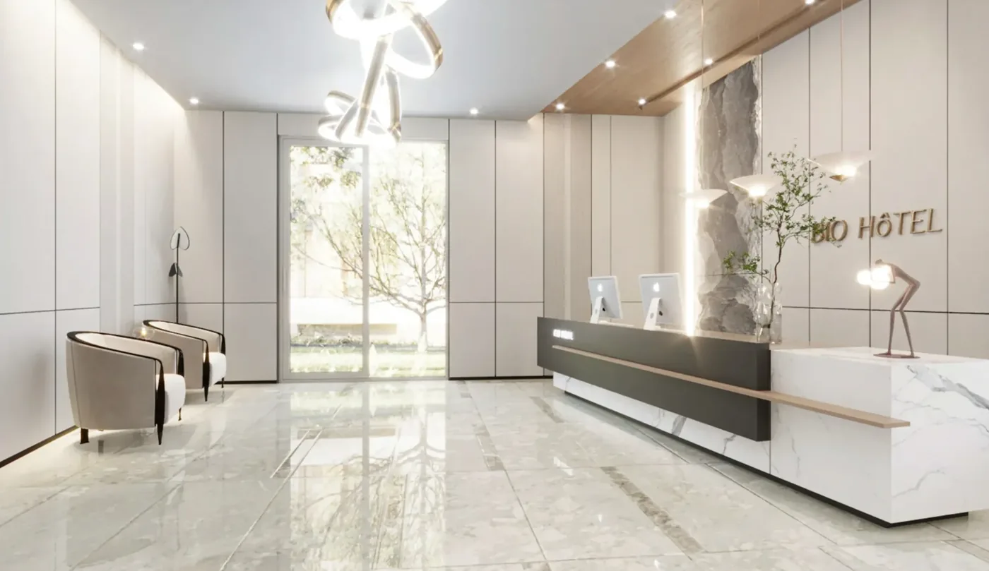 Bright hotel reception visual with a long counter and adjacent lounge area