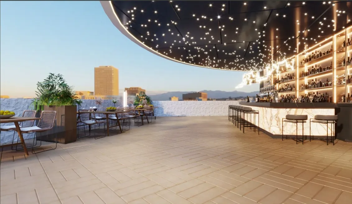 Rooftop bar visual with illuminated counter, stools and outdoor tables