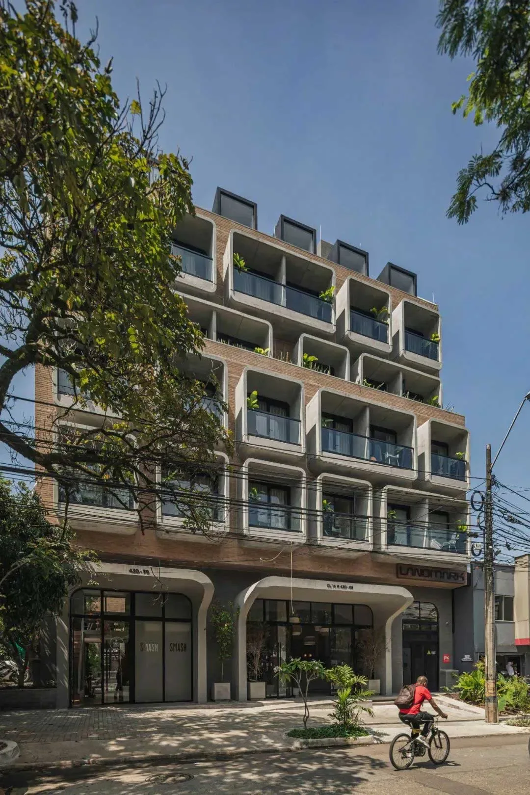 Street view of the hotel facade with repeated balcony bays