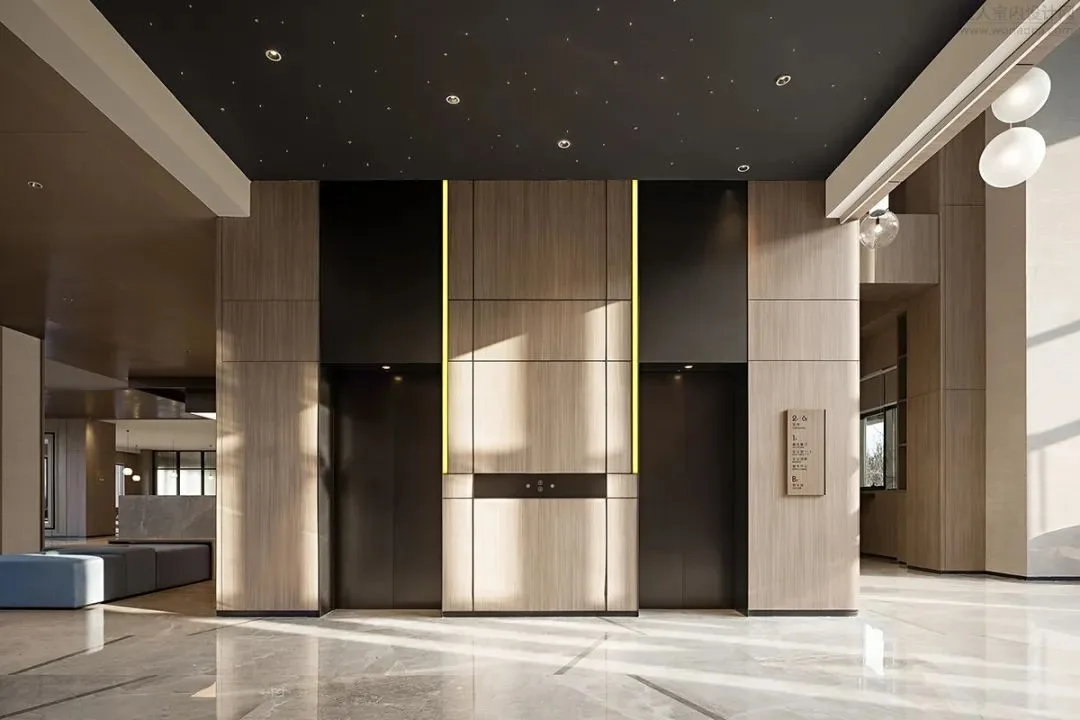 Lift lobby with dark wall panels, pale stone floor and two lift doors