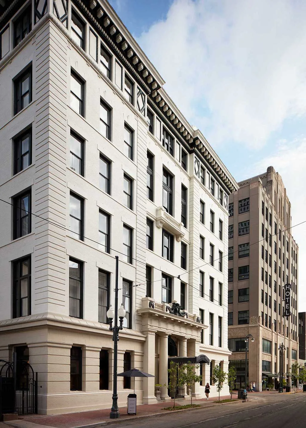 Oblique street view of the hotel facade and main entrance