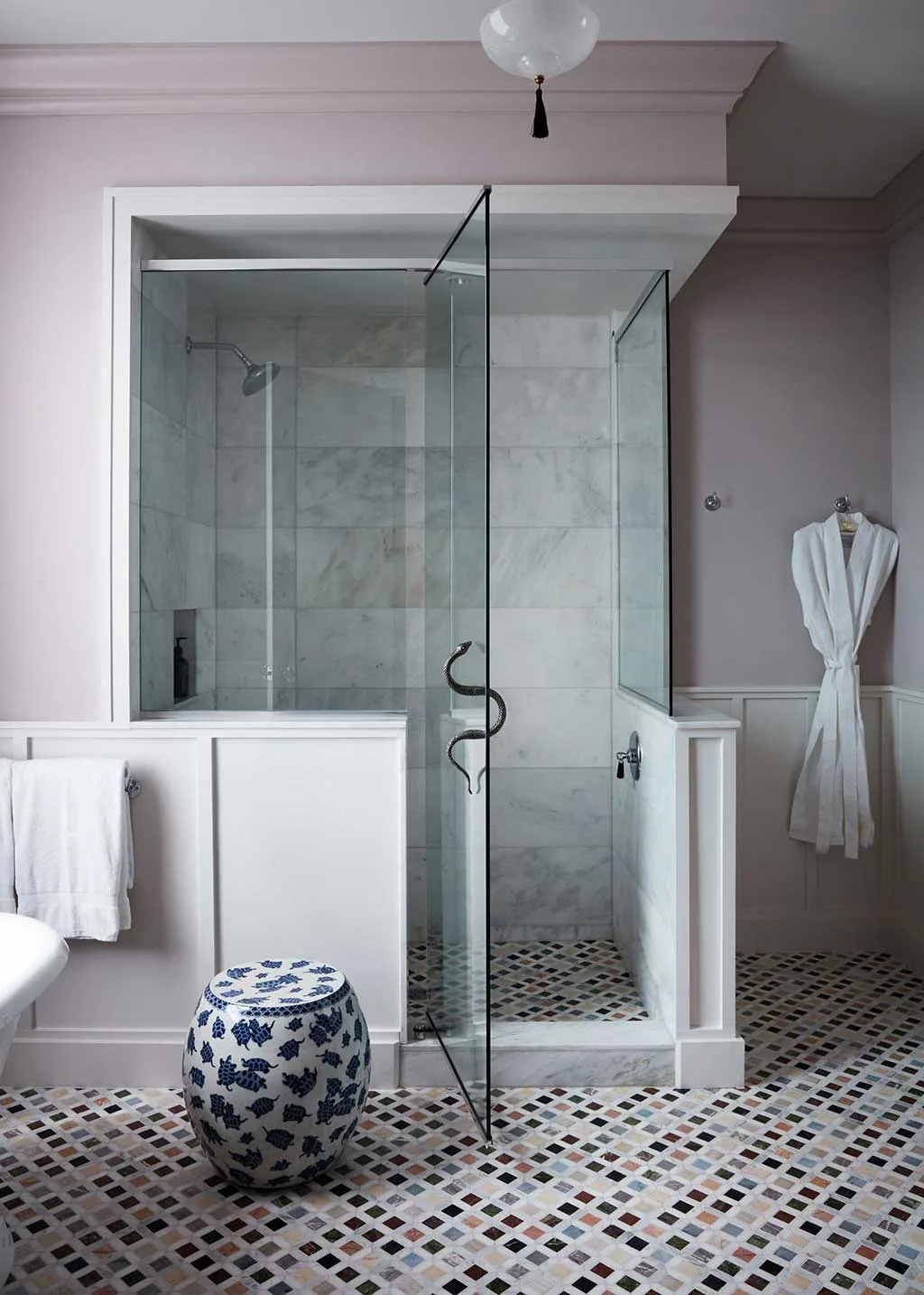 Guest bathroom with shower enclosure, freestanding bath and patterned floor