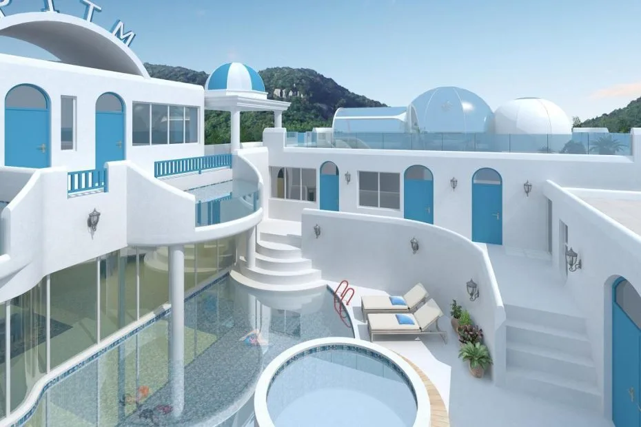 White-and-blue resort buildings surrounding a pool terrace on a hillside